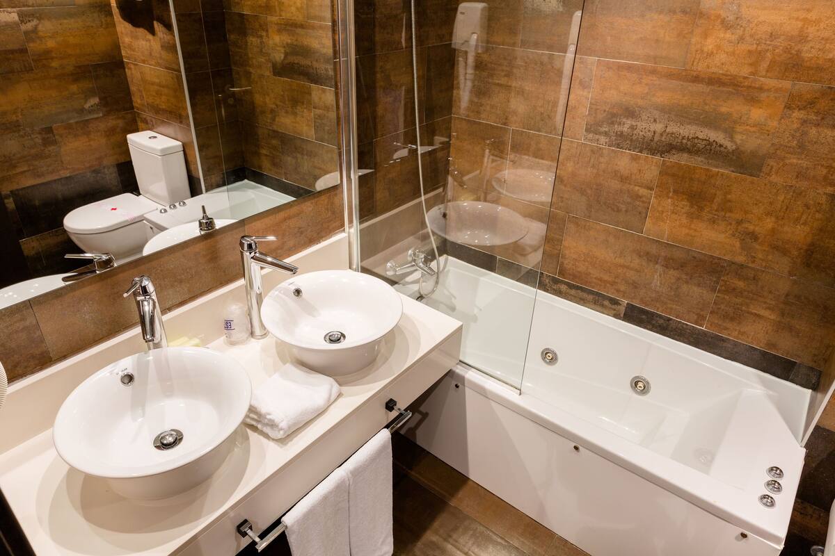 double or twin room, jetted tub | bathroom | hair dryer, towels