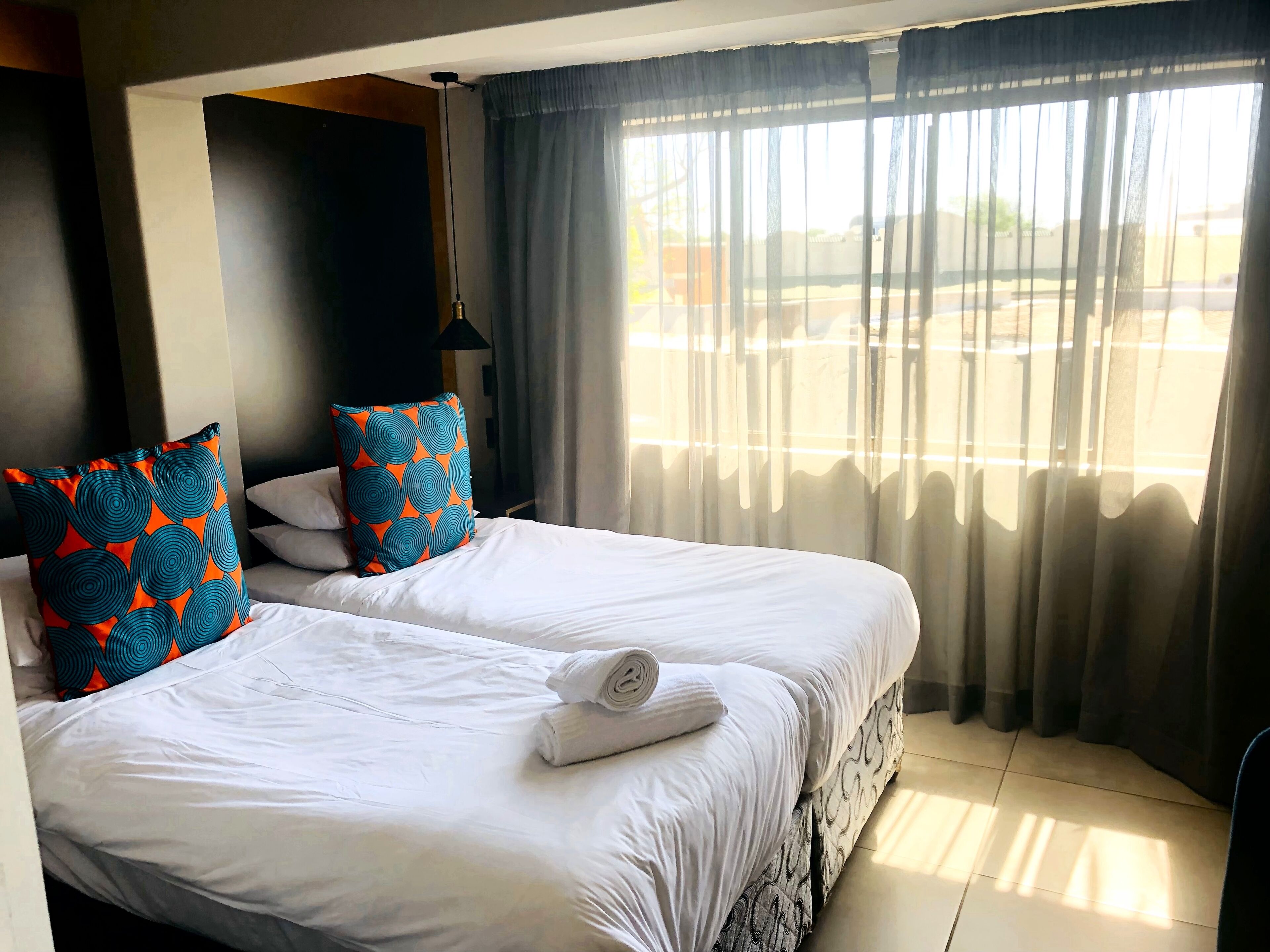 Family Room (First Floor) | Minibar, individually decorated, individually furnished, bed sheets