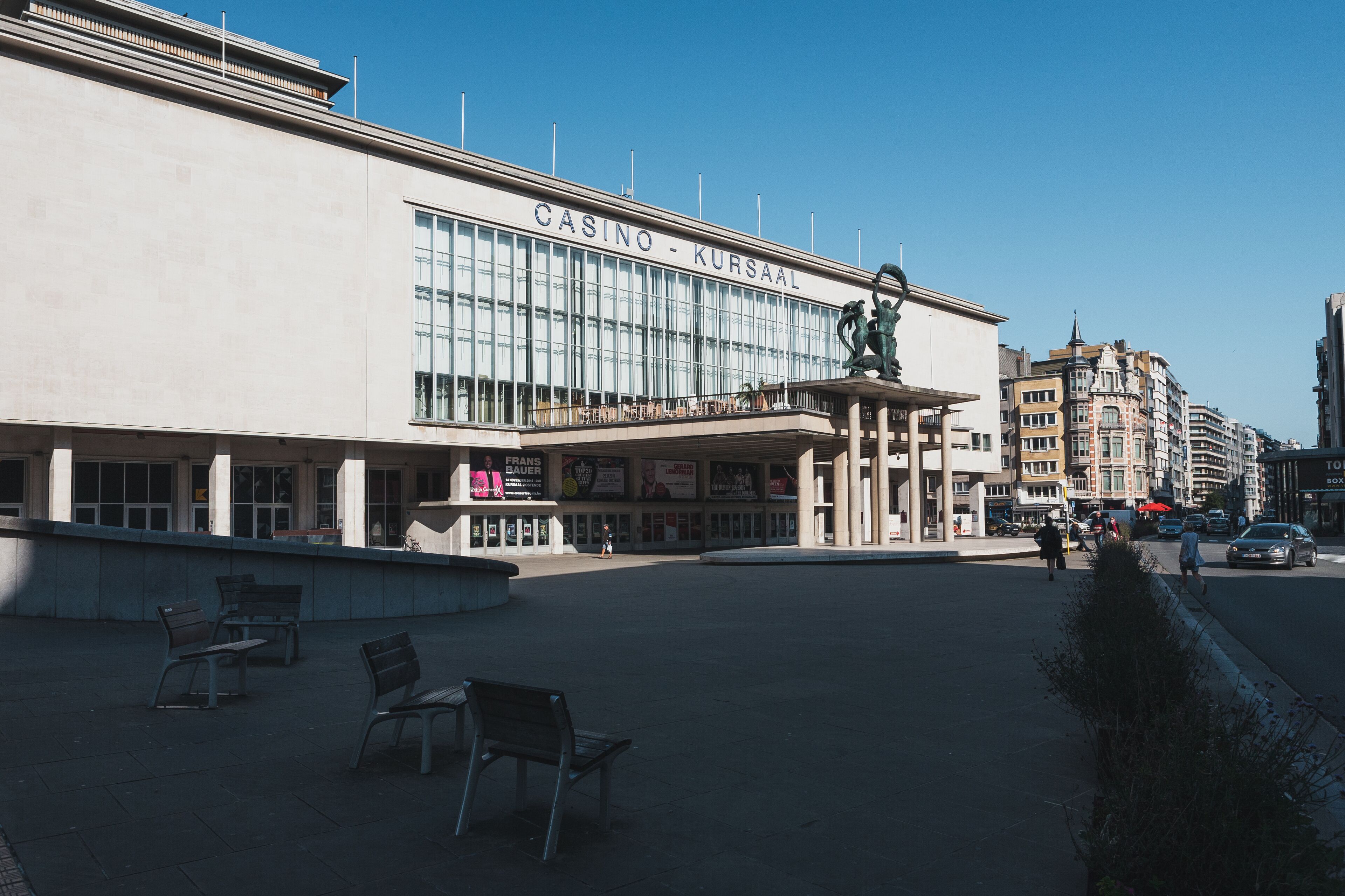 A large building with the sign "CASINO - KURSAAL" and a statue in front.