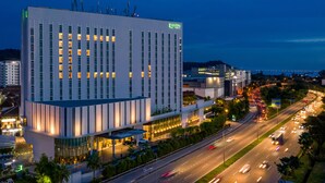 A modern hotel with a prominent 'EASTIN HOTEL' sign, featuring a large glass facade and a well-lit entrance. - Eastin Hotel Penang (George Town)