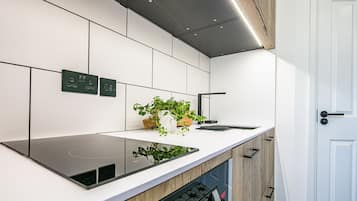 Deluxe Studio, Kitchenette, Ground Floor | Private kitchen | Fridge, espresso maker, coffee/tea maker, electric kettle