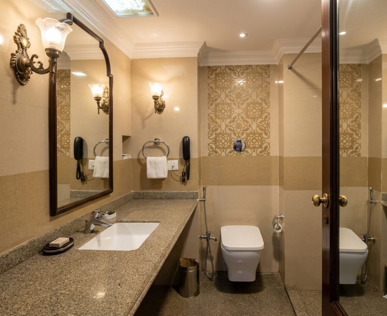 A bathroom with a sink, toilet, and shower.