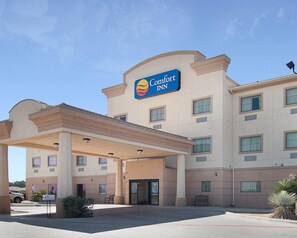 A Comfort Inn hotel with a covered entrance and multiple windows. - Comfort Inn I-20 Midland Stanton (Stanton)