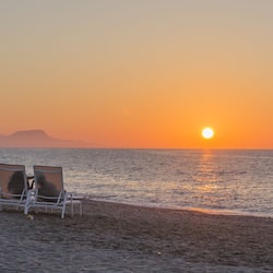 On the beach, sun loungers, beach umbrellas, beach towels