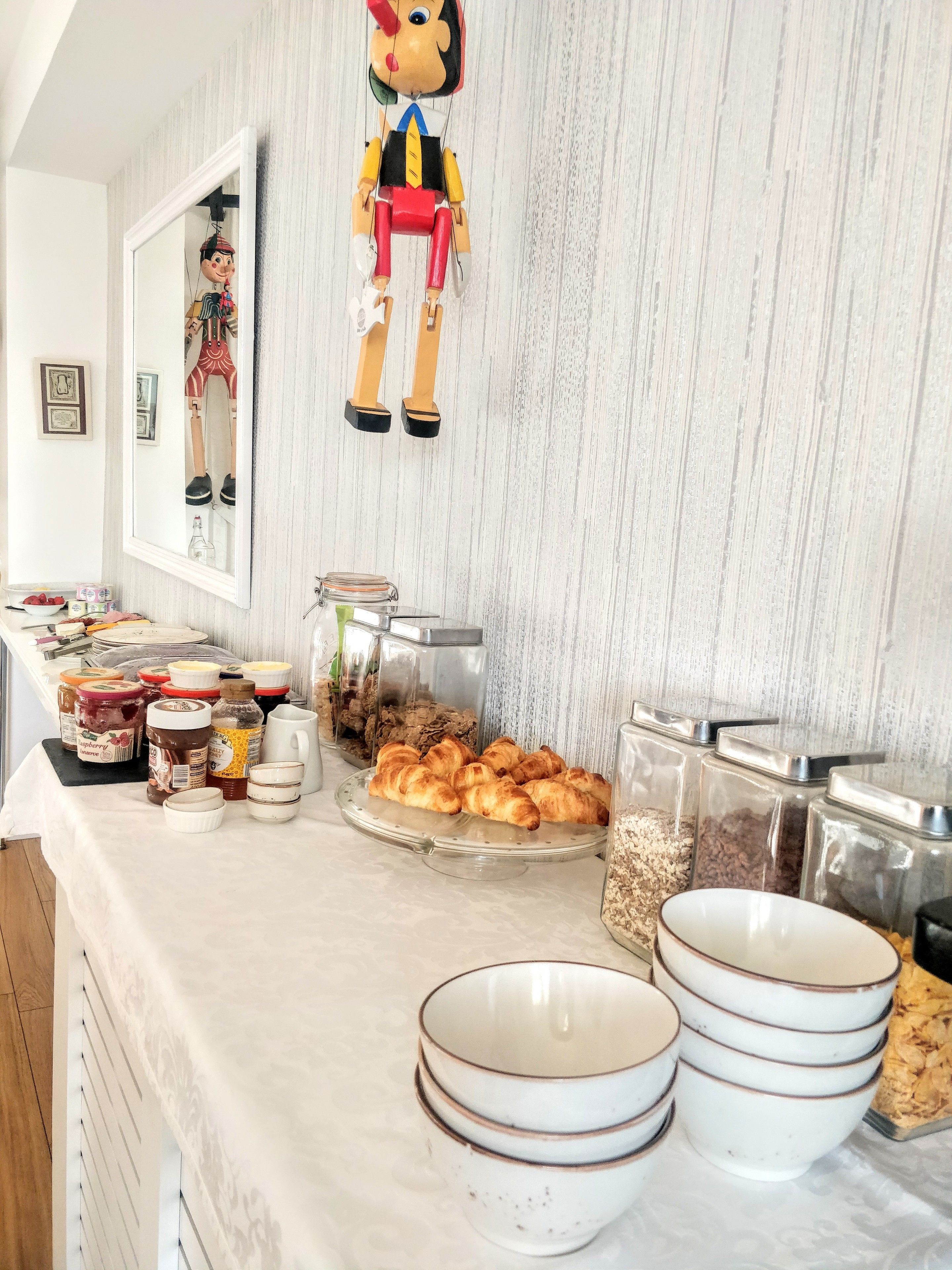 A breakfast buffet with various food items and condiments.