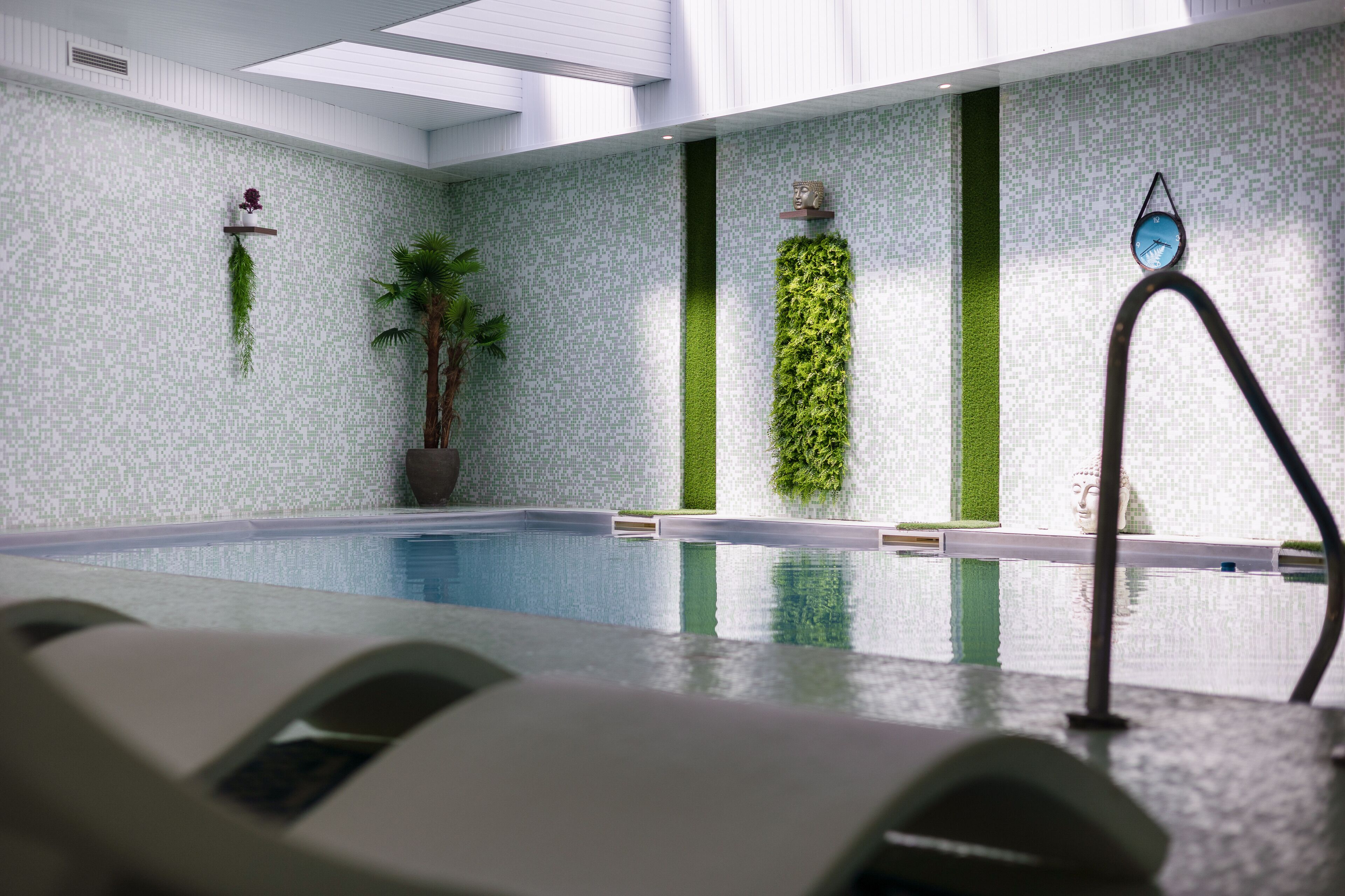 indoor pool, open 9:30 am to 7:30 pm, pool loungers