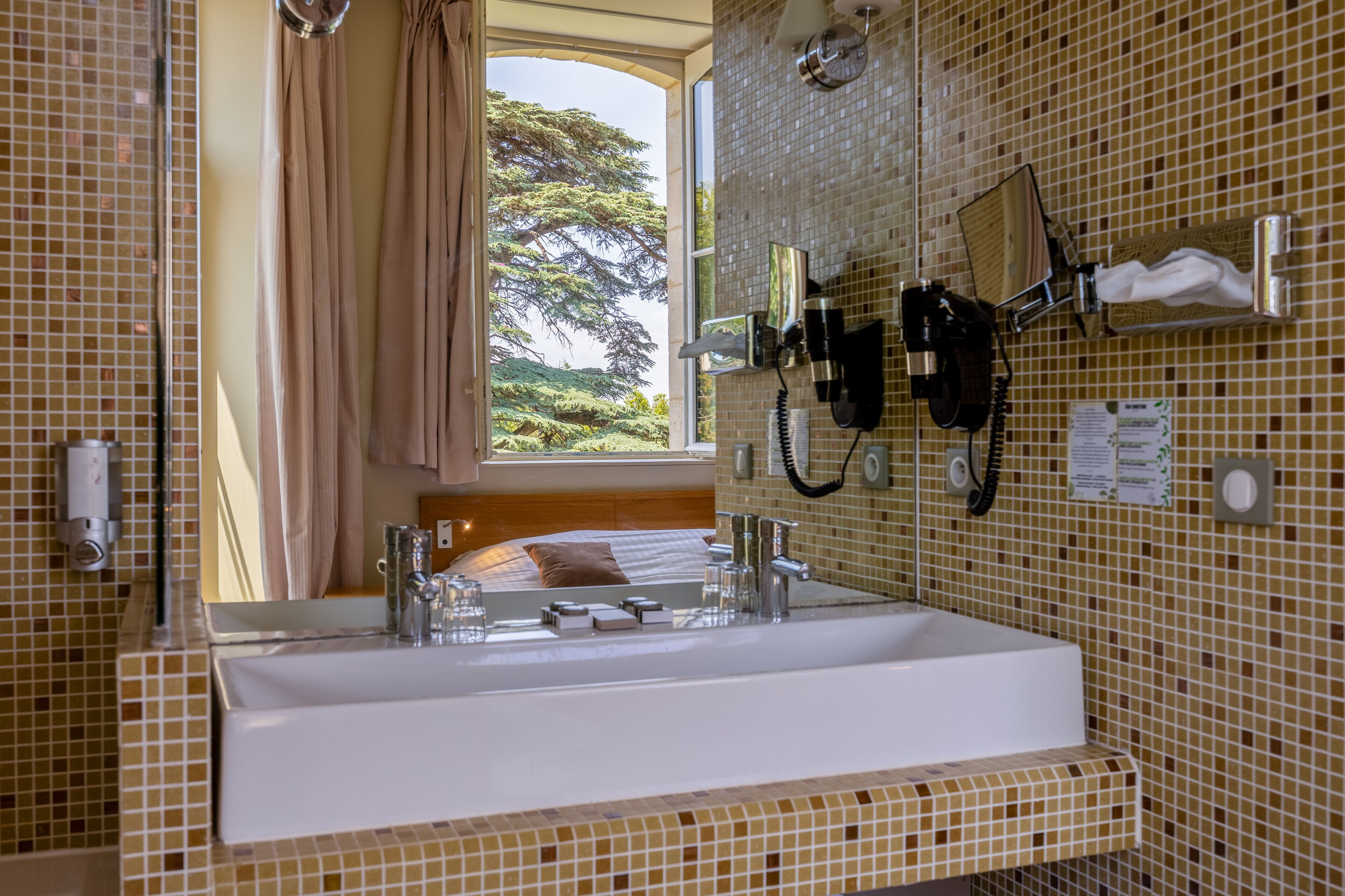 deluxe room | bathroom | shower, rainfall showerhead, free toiletries, hair dryer