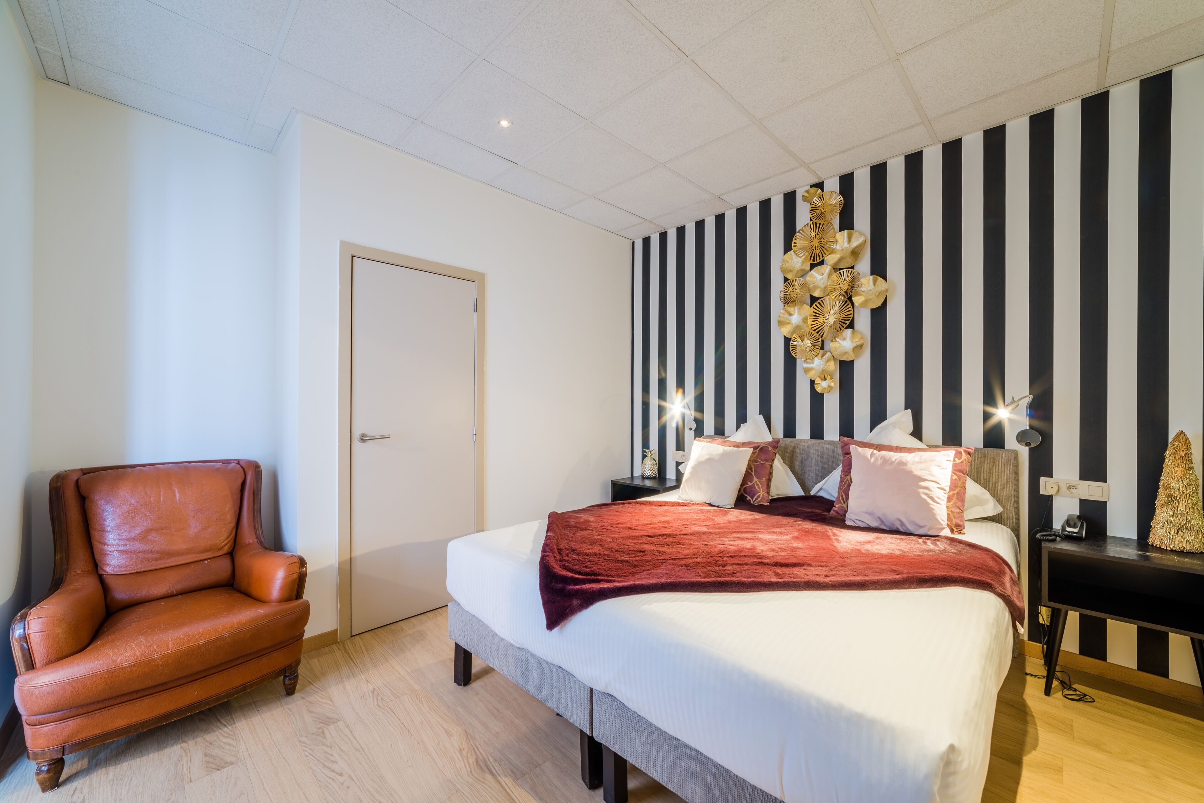 deluxe quadruple room | in-room safe, desk, blackout curtains, iron/ironing board