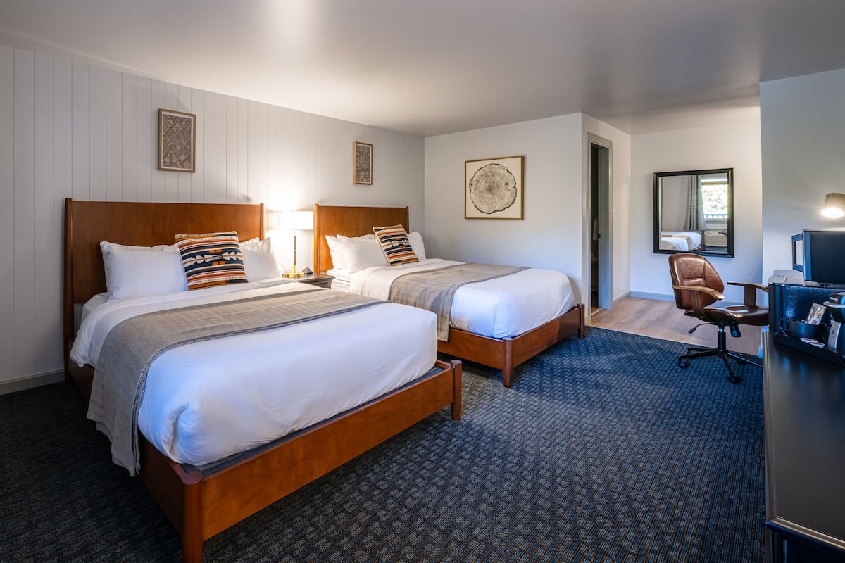 Premium bedding, pillow-top beds, desk, laptop workspace