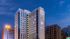 A multi-story hotel with illuminated signage, including "Citymax Hotels" and "Citymax" logos. - Citymax Hotel Al Barsha at the Mall (Dubai)