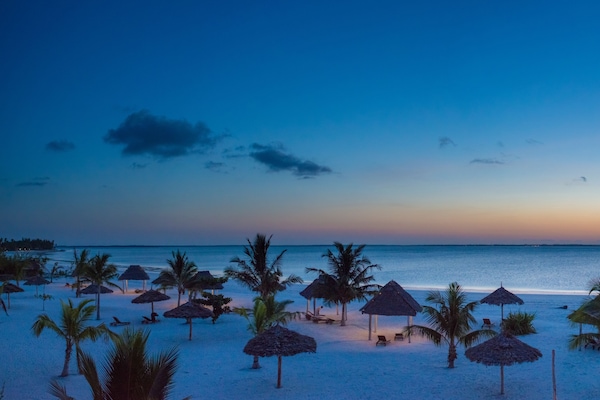 Private beach, white sand, free beach cabanas, sun-loungers