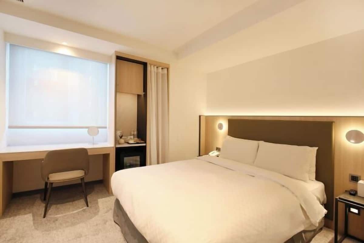 Premium bedding, down comforters, pillowtop beds, free minibar