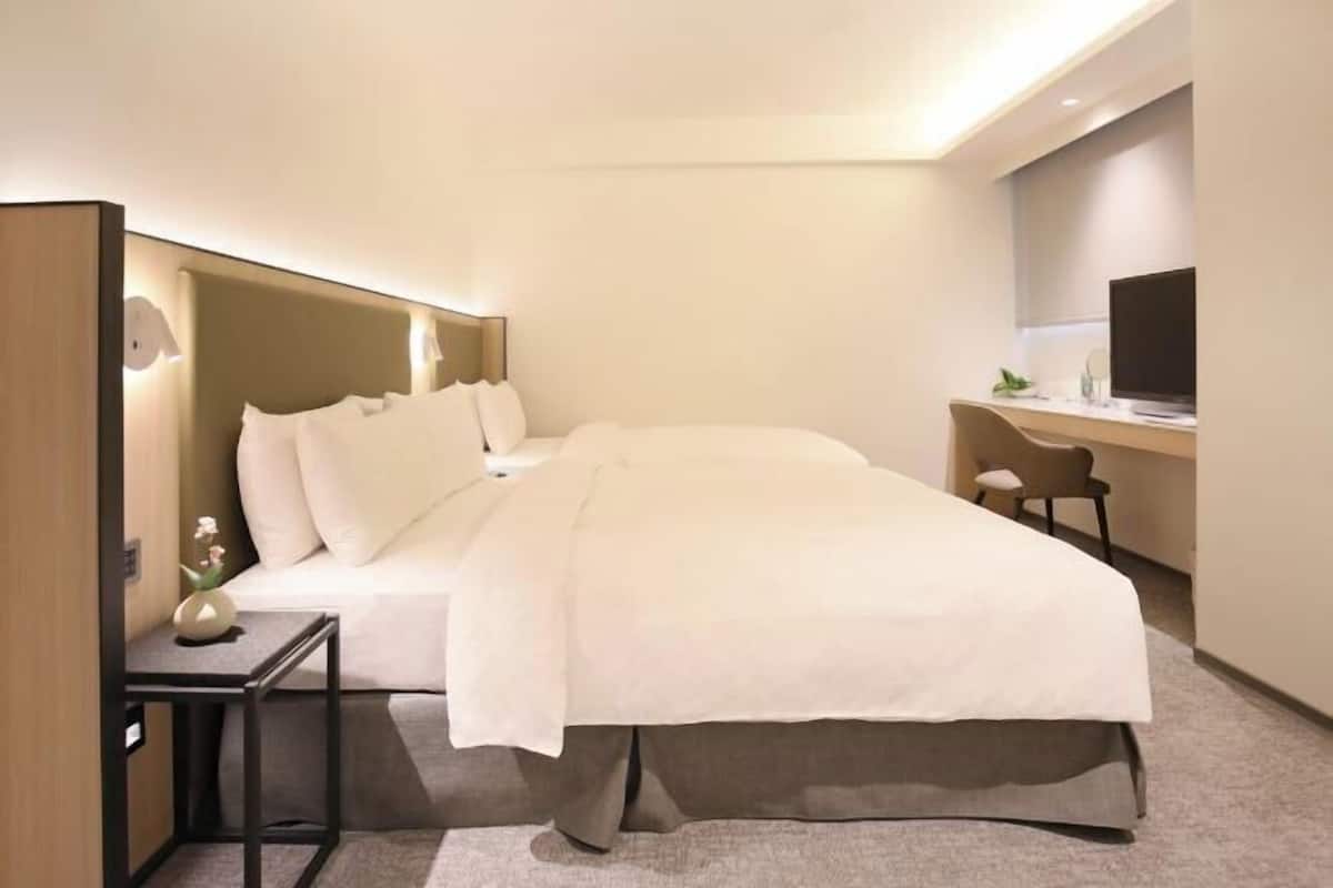 Premium bedding, down comforters, pillowtop beds, free minibar