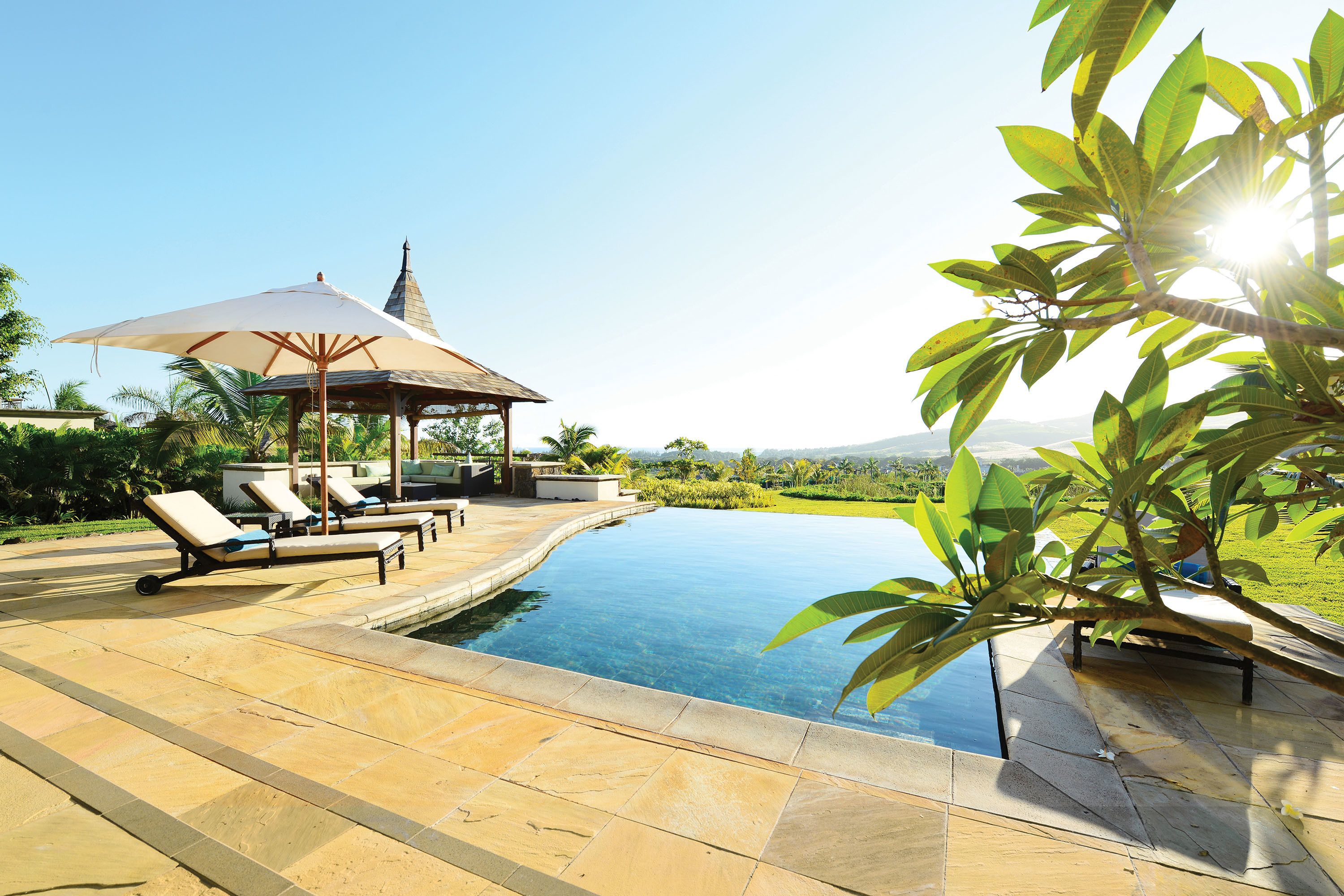 outdoor pool, pool umbrellas, pool loungers