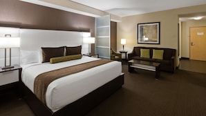 A hotel room with a large bed, a sofa, a desk, and a chair. - Best Western Plus Miami Intl Airport Hotel & Suites Coral Gables (Miami)