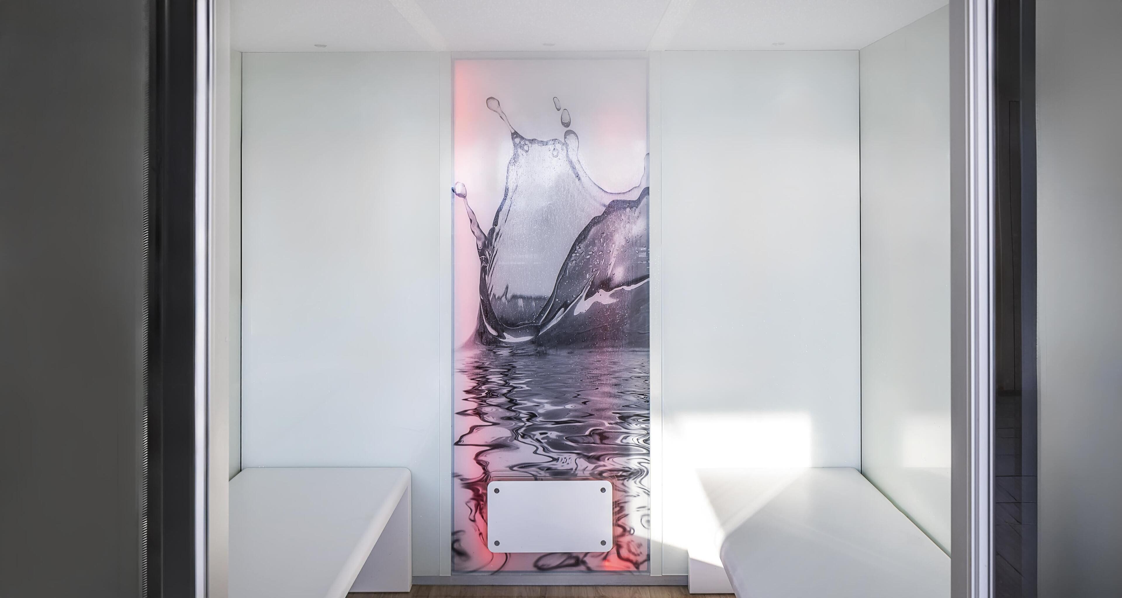 A narrow hallway with a large, abstract wall art depicting a splash of water.