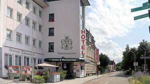 A hotel with a prominent 'HOTEL' sign on the facade, a 'Hotel & Restaurant' sign, and a 'Restaurant' sign indicating dining options. - Hotel & Restaurant Danner (Rheinfelden (Baden))