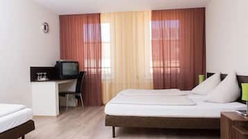 Economy Triple Room (Private External Shower and Toilet) | Desk, iron/ironing board, cribs/infant beds, free WiFi