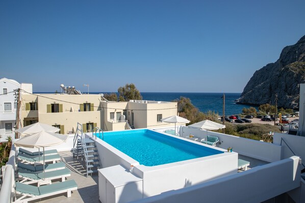 Seasonal outdoor pool, open 8:30 AM to 7:00 PM, pool umbrellas