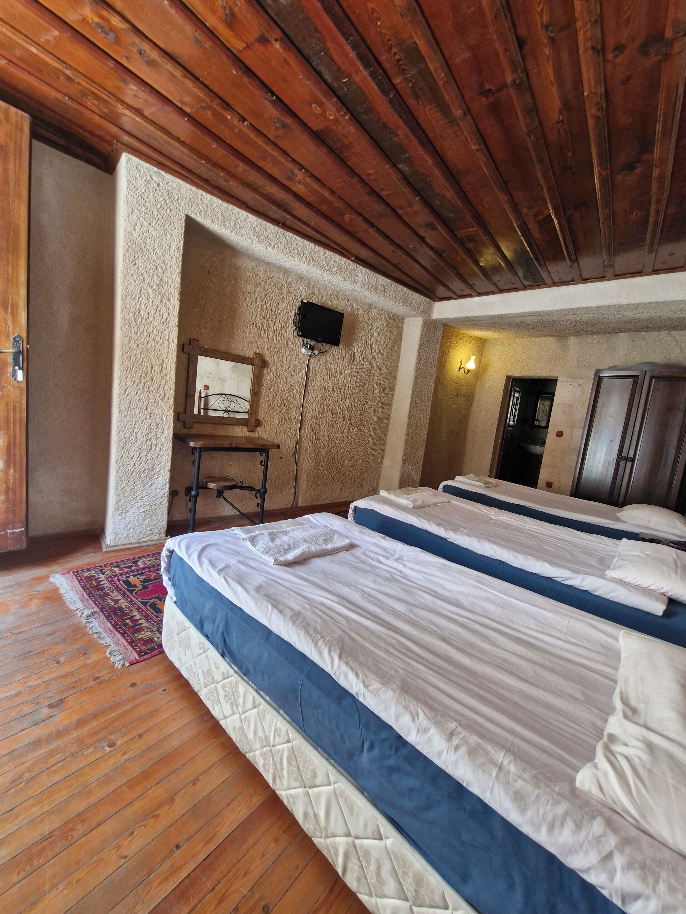 economic triple cave room | premium bedding, soundproofing, iron/ironing board, free wifi