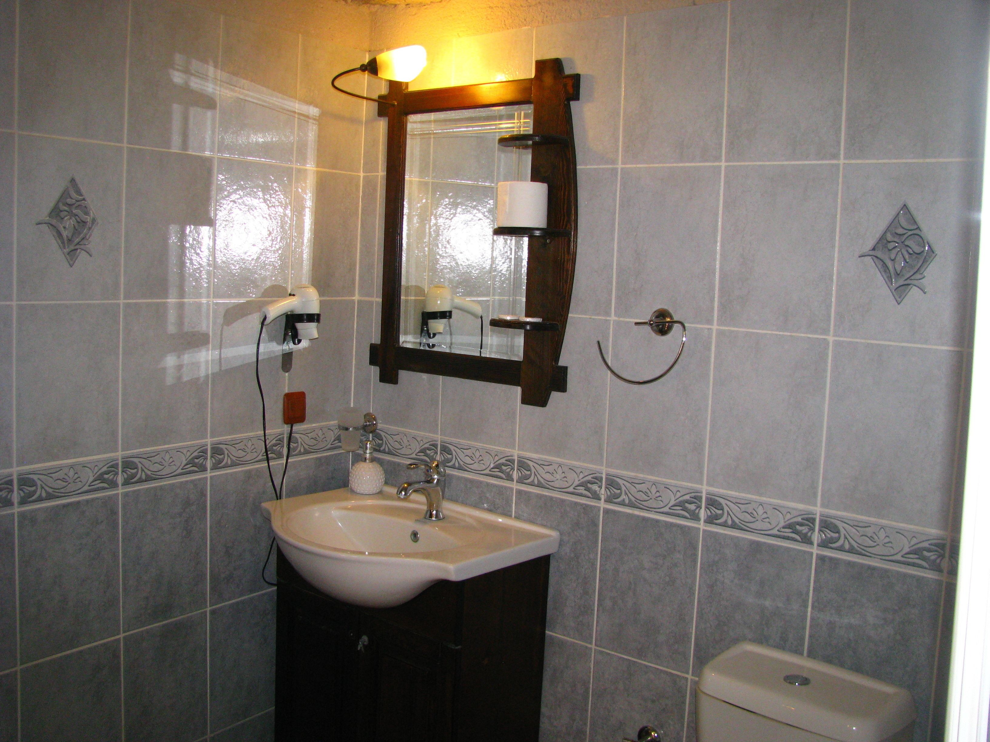 economic triple cave room | bathroom | free toiletries, hair dryer, slippers, towels