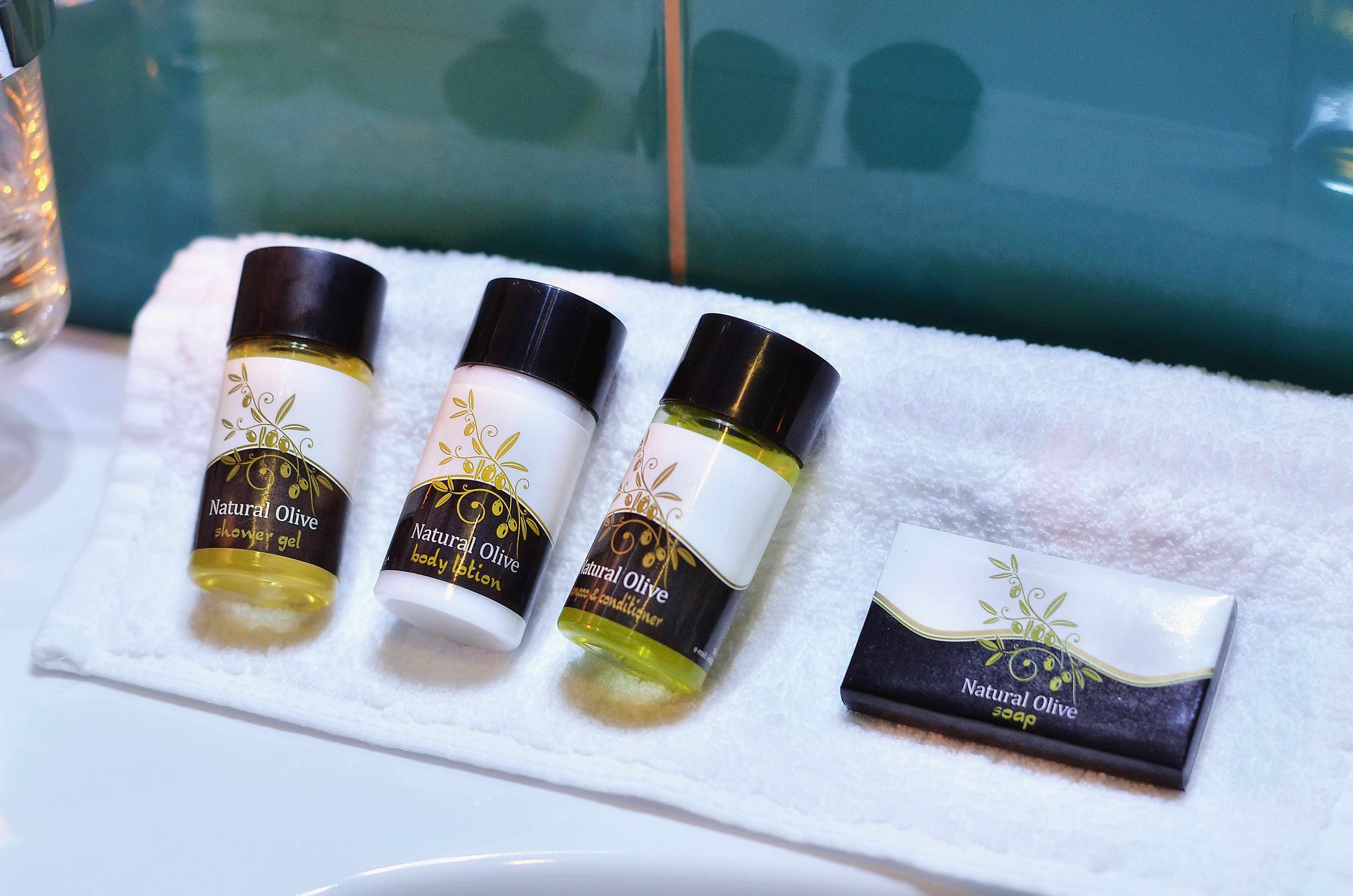 rainfall showerhead, designer toiletries, hair dryer, slippers