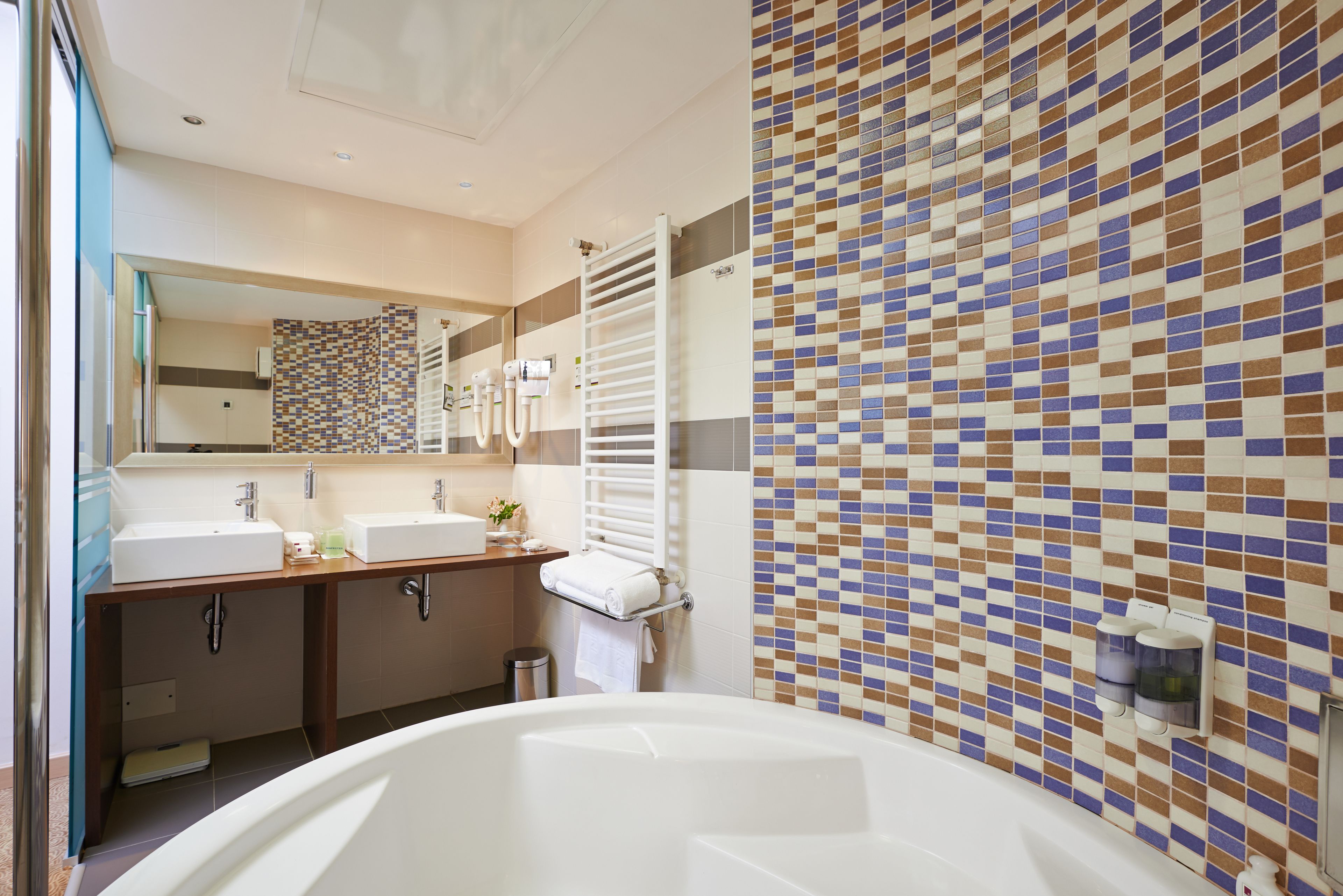 superior suite | bathroom | eco-friendly toiletries, hair dryer, slippers, towels