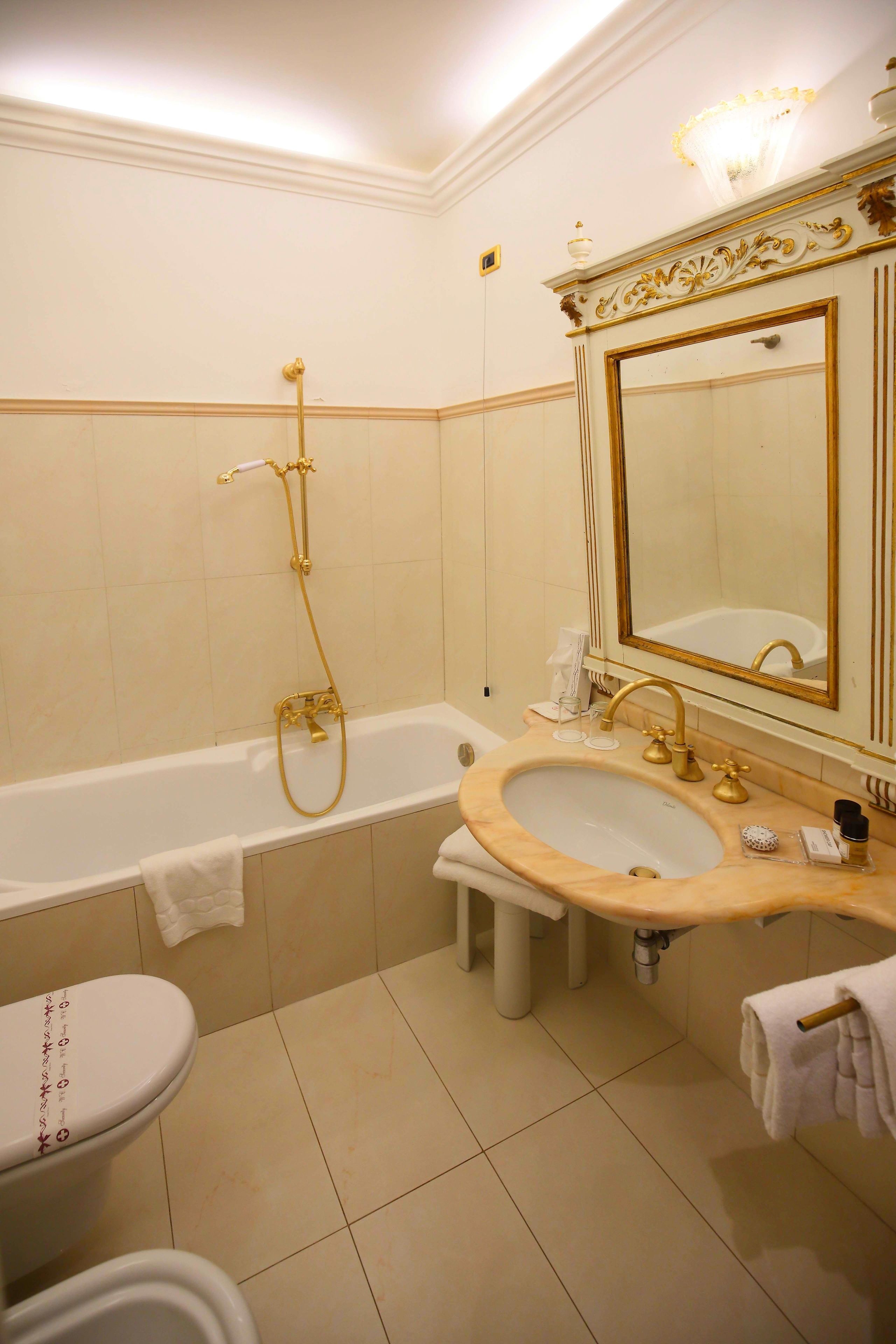 A bathroom with a bathtub, a sink, and a toilet.
