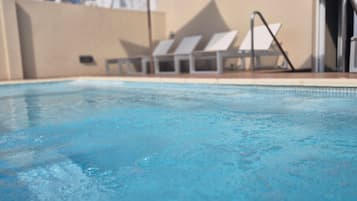 Outdoor pool, pool umbrellas, sun loungers