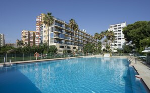 Seasonal outdoor pool, open 10:00 AM to 6:00 PM, pool umbrellas