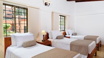 Triple Room | Minibar, in-room safe, desk, blackout curtains