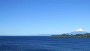 A clear view of a large body of water with a distant mountain range.