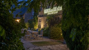 A stone building with a sign reading "The Dial House Hotel & Restaurant." - The Dial House (Cheltenham)