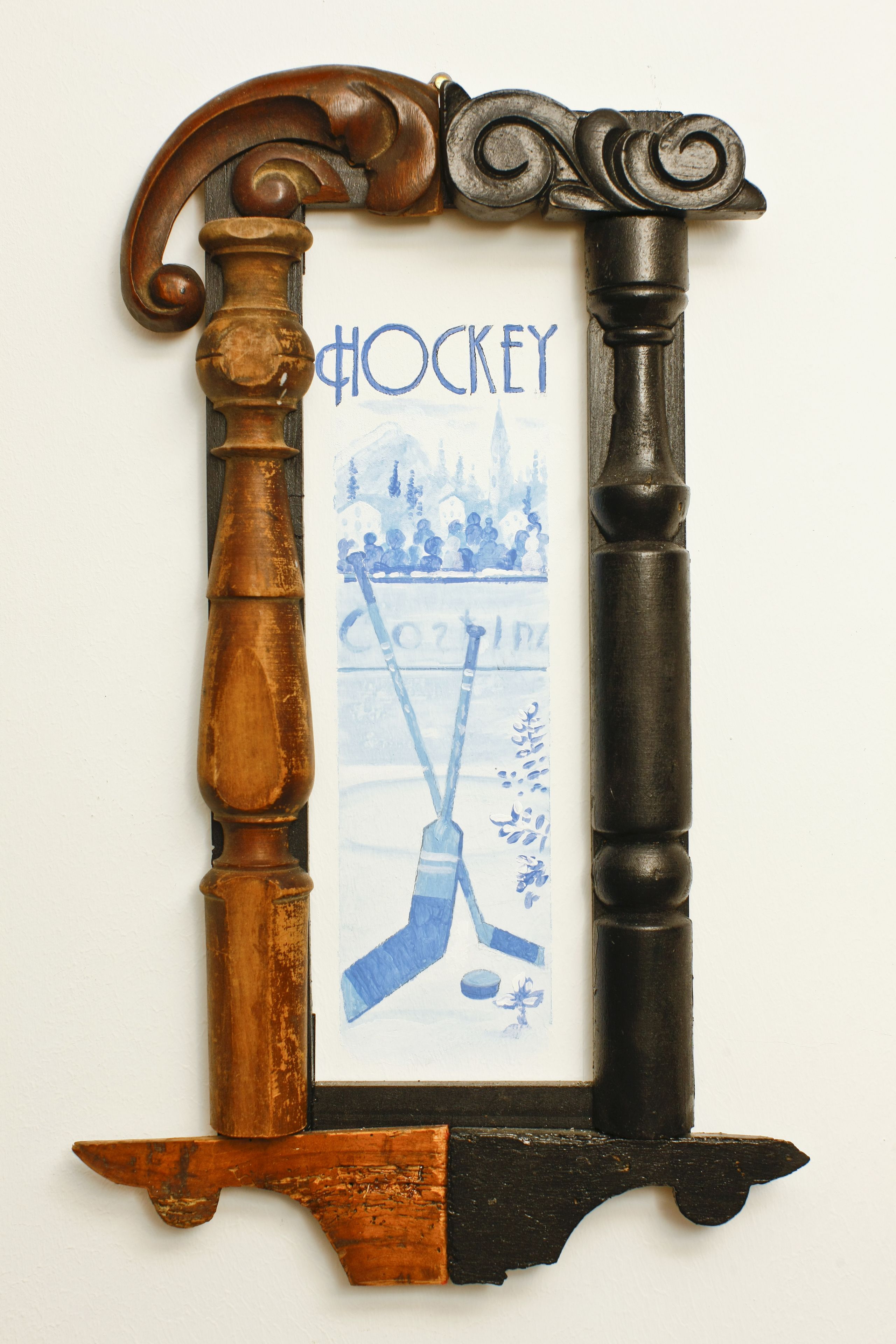 A hockey-themed wall decoration with a hockey stick and puck design.