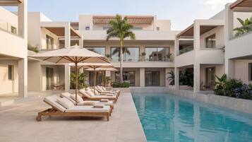 2 outdoor pools, open 10:30 AM to 7:00 PM, pool umbrellas