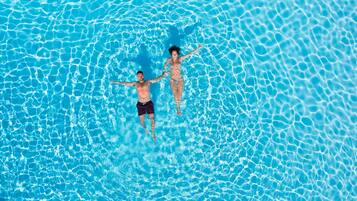 2 outdoor pools, open 10:30 AM to 7:00 PM, pool umbrellas