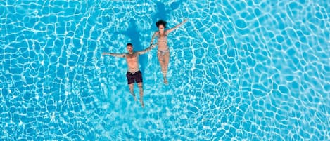 2 outdoor pools, open 10:30 AM to 7:00 PM, pool umbrellas