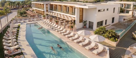 2 outdoor pools, open 10:30 AM to 7:00 PM, pool umbrellas