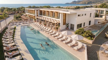 2 outdoor pools, open 10:30 AM to 7:00 PM, pool umbrellas