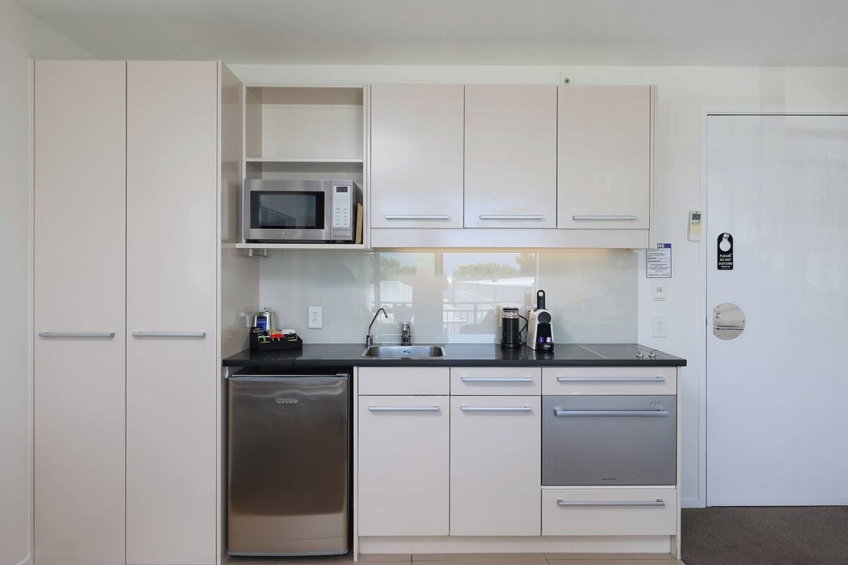 two bedroom | private kitchen | fridge, microwave, stovetop, dishwasher
