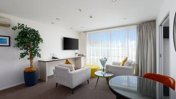 Executive One Bedroom | Living area | 55-inch flat-screen TV with digital channels, TV, Netflix