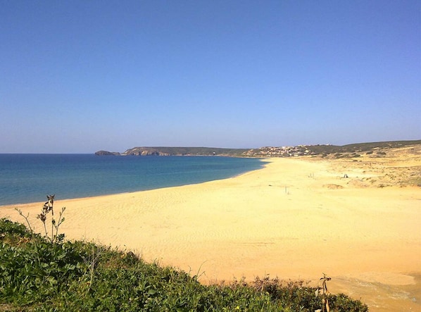 Beach nearby, white sand, beach towels