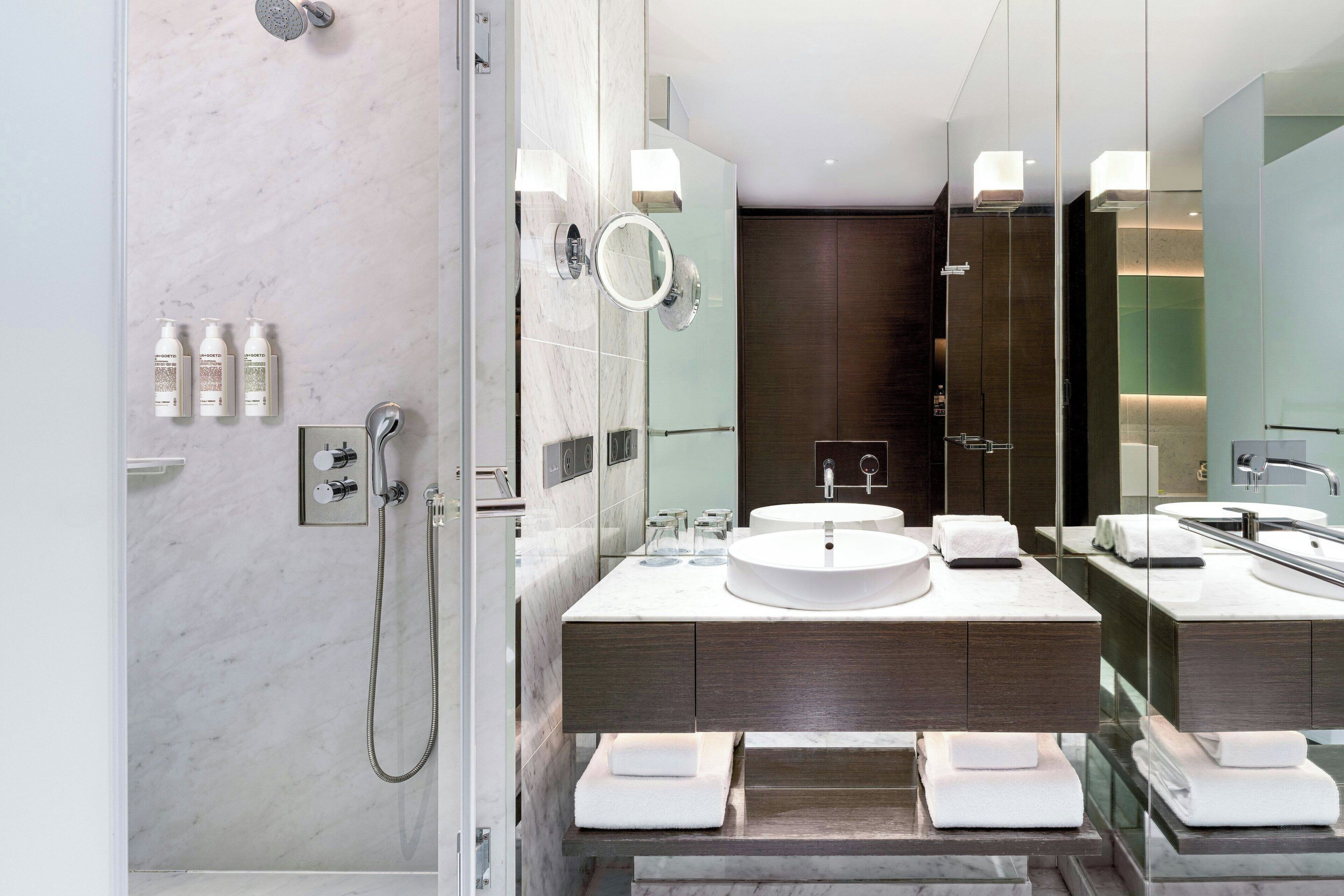 hair dryer, bathrobes, slippers, towels