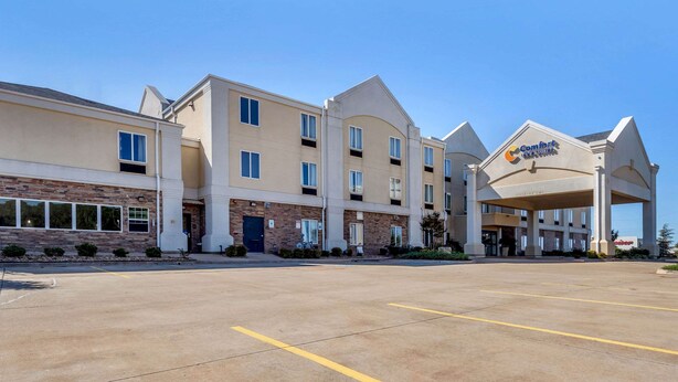 A hotel with a modern design, featuring a central atrium and multiple levels.