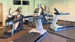 A hotel fitness center with treadmills and exercise equipment. - Sleep Inn & Suites Evergreen I-65 (Evergreen)