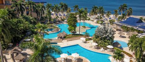 7 outdoor pools, pool umbrellas, pool loungers