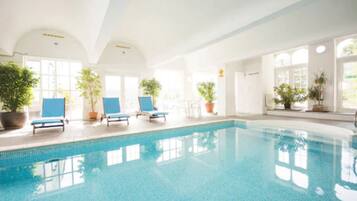 Indoor pool, open 8:00 AM to 9:00 PM, pool loungers