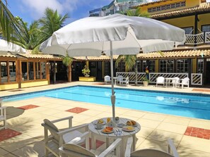 Outdoor pool, pool umbrellas, sun loungers