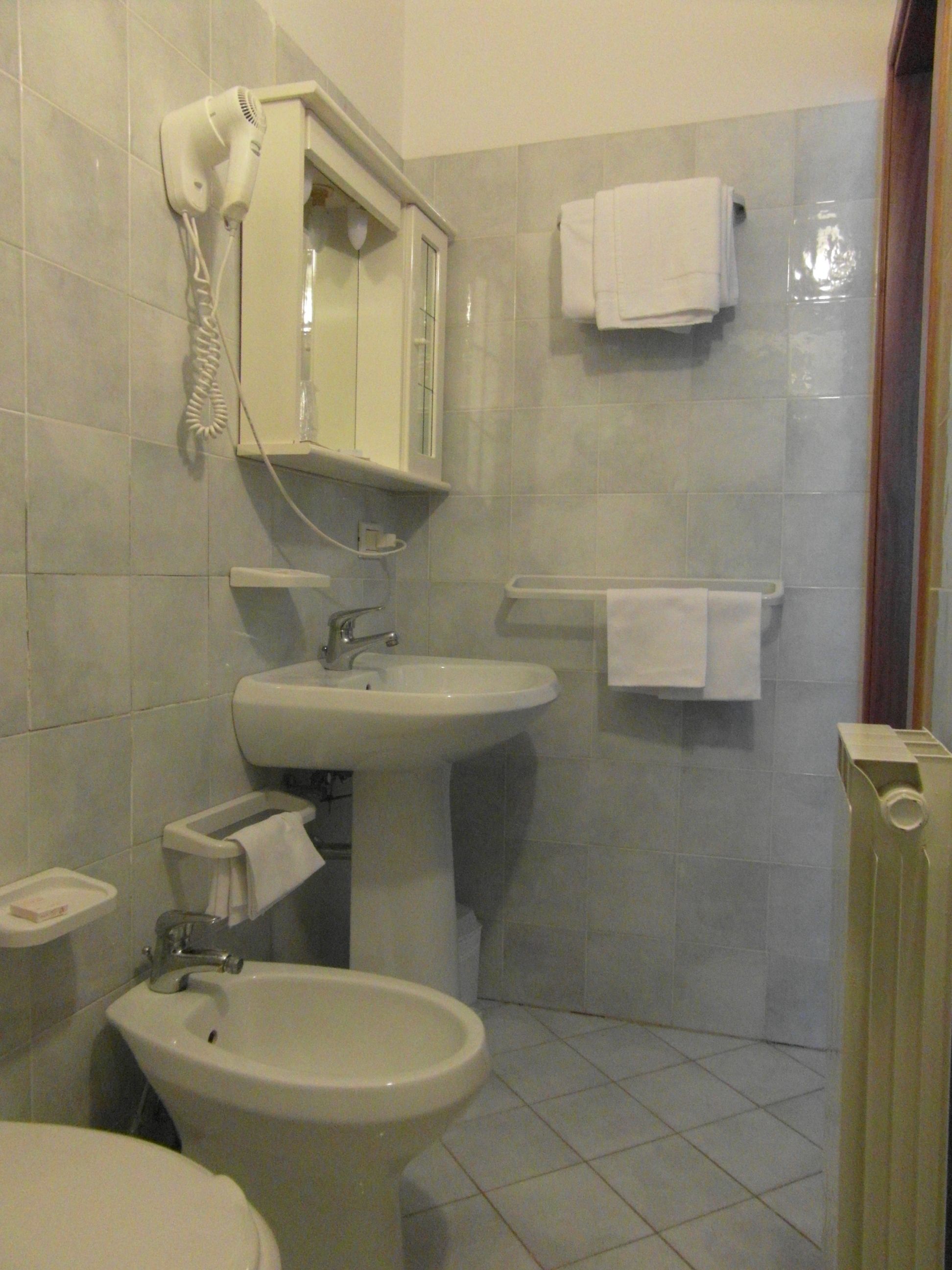 rainfall showerhead, hair dryer, bathrobes, slippers