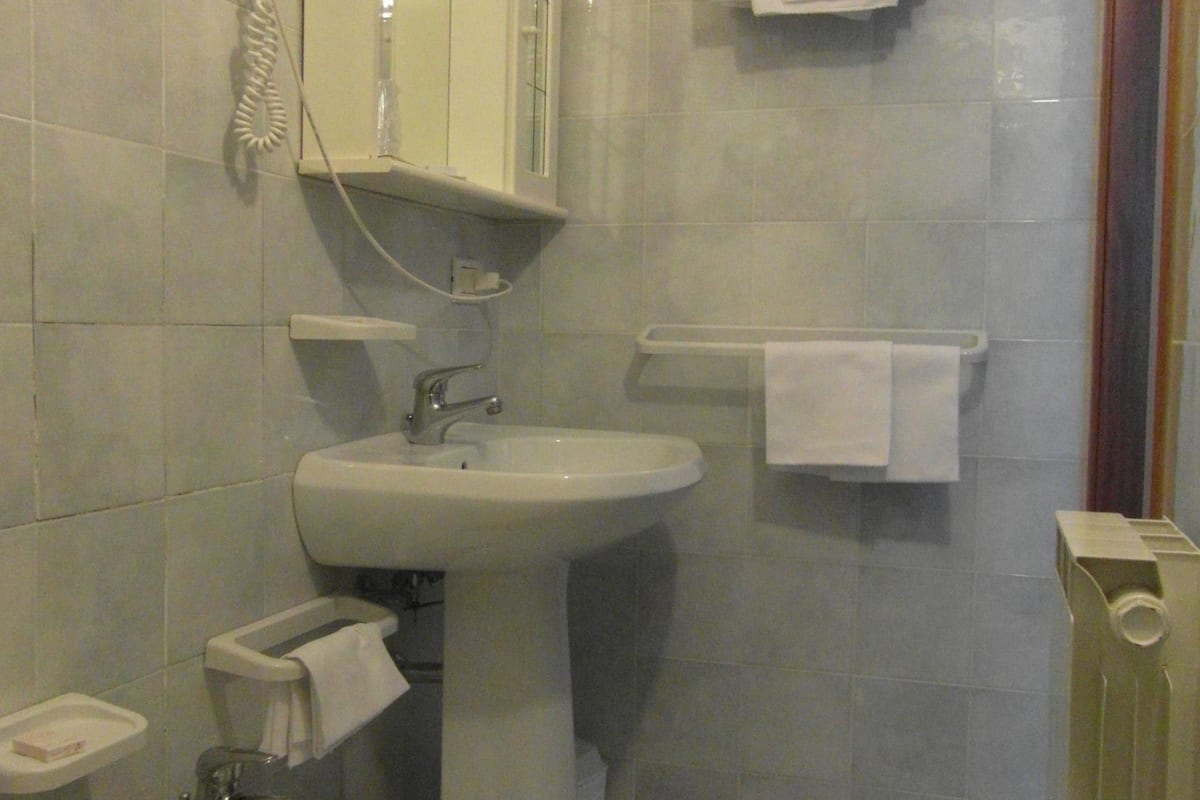 rainfall showerhead, hair dryer, bathrobes, slippers